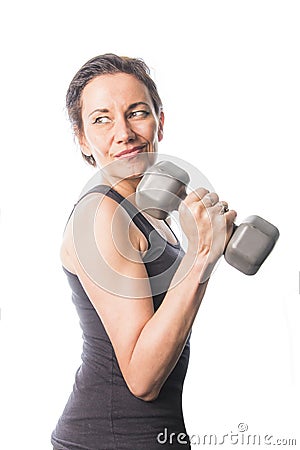 Mature woman lifting weights Stock Photo