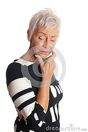 Mature woman looking troubled Stock Photo