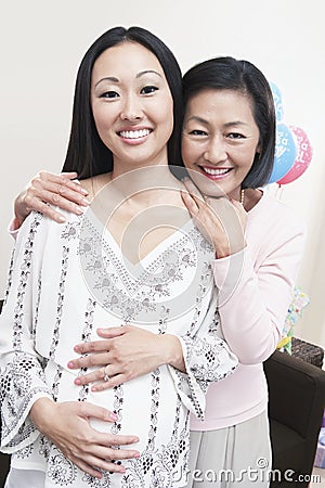 Mature Woman With Pregnant Daughter Stock Photo