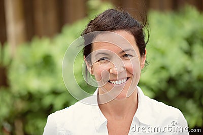 Mature woman smiling. Outside Stock Photo