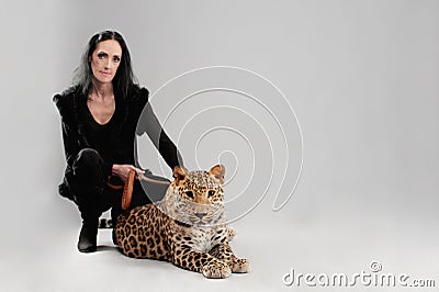 Mature woman and spotty leopard Stock Photo