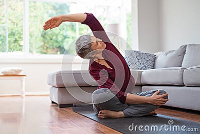 Mature woman in yoga pose Stock Photo