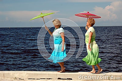 Mature women at seashore Stock Photo