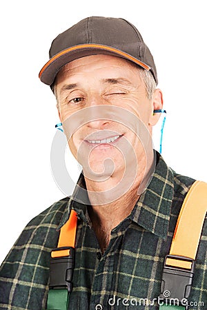 Mature worker blinks his eye Stock Photo