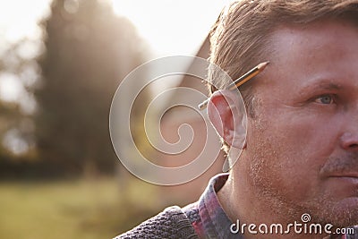 Mature Workman With Pencil Behind His Ear Stock Photo