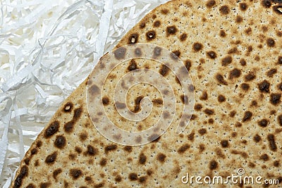 Matzo texture, a top view of a piece of traditional wheat dry bread served on Hebrew Passover Stock Photo