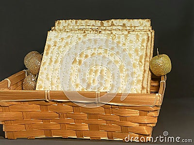 Matzot in a wicker basket on black background. Pesach-Jewish easter. Stock Photo