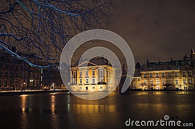 The Mauritshuis seen from de Hofvijver in the Hague at night, covered by snow. Stock Photo