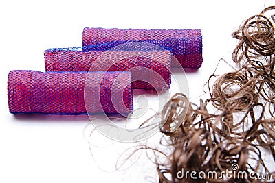 Mauve curler and hairpiece Stock Photo