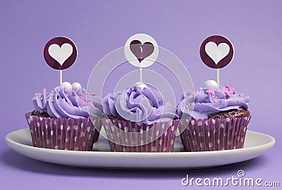 Mauve purple decorated cupcakes Stock Photo