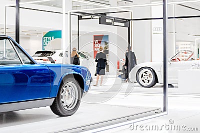 People tourists walking among Antique and modern cars in museum exhibition in Berlin Editorial Stock Photo