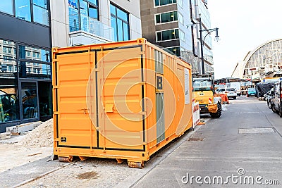 Yellow Cargo container using as accommodation for workers at construction site at the city street Editorial Stock Photo