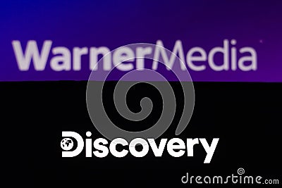 May 23, 2021, Brazil. In this photo illustration the Discovery logo seen displayed on a smartphone in the background the Cartoon Illustration