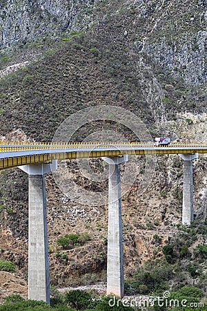 Truck is driving across a tall bridge in Mexico Editorial Stock Photo