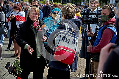 May 24 2020 Minsk Belarus. Virus mask mature woman standing wearing face protection in prevention for coronavirus in Belarus Editorial Stock Photo