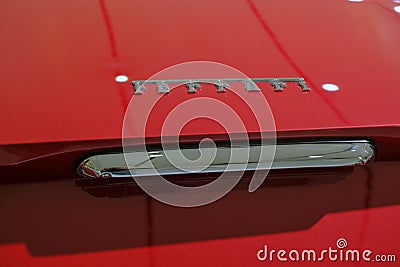 May 2022 Modena, Italy: Ferrari logo icon close-up on red car. details of the sportscar Editorial Stock Photo