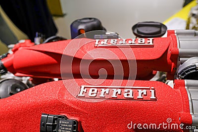 May 2022 Modena, Italy: Ferrari`s red sportscar engine close-up. Automobile details. Car repair Editorial Stock Photo