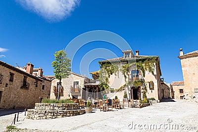 May 2019, Pedraza, Castilla Y Leon, Spain: tourists in a small square behind Plaza Mayor. Editorial Stock Photo