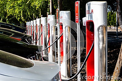 May 5, 2019 San Jose / CA / USA - Tesla vehicles plugged in at a charging station in south San Francisco bay area; Silicon Valley Editorial Stock Photo