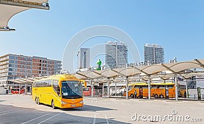 yellow buse of Regiojet company at the boarding of passengers at the bus station of Bratislava Editorial Stock Photo