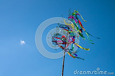 May tree, traditional hungarian austrian german folklore decoration in may with blue sky Stock Photo