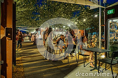 Party lights on trees with people celebrating summer festival in Tucson, Arizona. Editorial Stock Photo