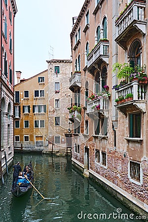 Gondola ride on canal in Venice Editorial Stock Photo