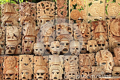 Mayan wood mask rows Mexico handcraft faces Stock Photo