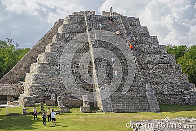 Mayapan, Mexico: Tourists visit the Mayan Temple of Kukulcan in Mayapan Editorial Stock Photo