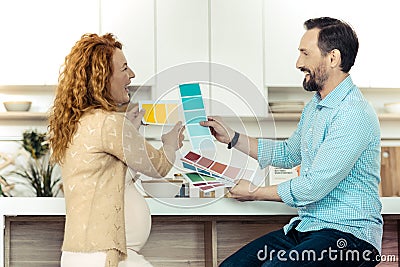 Positive family choosing the best color Stock Photo