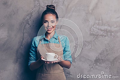 Maybe you want a cup of coffee Girl holding a drink stretching Stock Photo