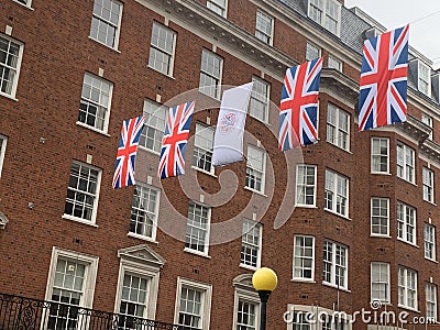 Rainy day in Mayfair in London with coronation flags and British flags in May 2023 Editorial Stock Photo
