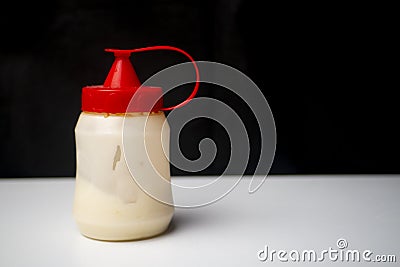 Mayonnaise bottle with red cap Stock Photo