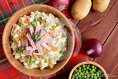 Mayonnaise salad with Bologna sausage, pea, onion, pickles and carrot Stock Photo