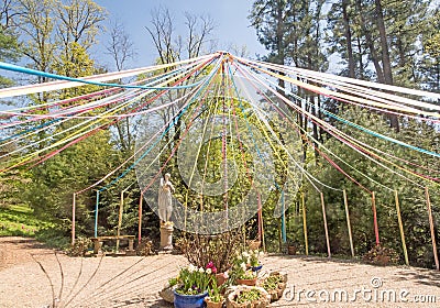 Maypole painted pole, decorated with colored ribbons Editorial Stock Photo