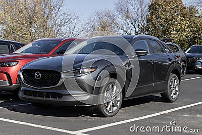 Mazda CX-30 display at a dealership. Mazda offers the CX-30 in S, Select Sport, Preferred, Carbon Edition models. MY:2024 Editorial Stock Photo