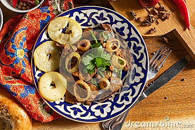Roast lamb liver, with apples, onions and soy sauce Stock Photo