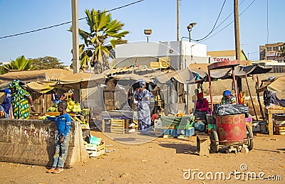 MBour, Senegal, AFRICA - April 22, 2019: Street fruit market where locals sell tropical fruits like melons, mangoes, oranges, Editorial Stock Photo
