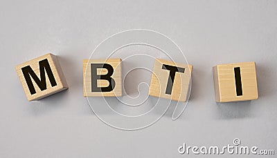 MBTI acronym, letters on wooden dices. Psychology concept Stock Photo