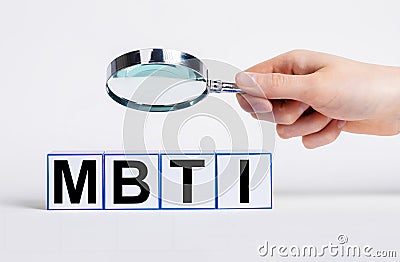 MBTI myers typology system analysis under magnifying lens. Psychology categories Stock Photo