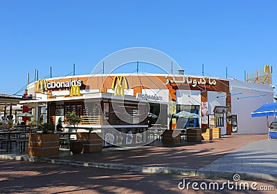 Mc Donald's Fast food restaurant with arabic sign Editorial Stock Photo