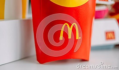 McDonald`s logo on company production boxes. Close up Editorial Stock Photo