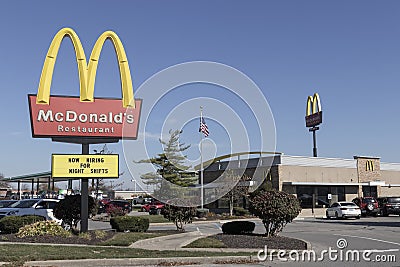 McDonald`s Restaurant. McDonald`s is offering employees higher hourly wages, paid time off, and tuition payments Editorial Stock Photo