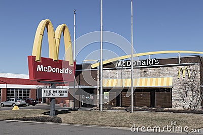 McDonald's Restaurant. McDonald's is offering employees higher hourly wages, paid time off, and tuition payments Editorial Stock Photo