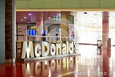 McDonald`s sign at McDonald`s restaurant in Barcelona international arport Editorial Stock Photo