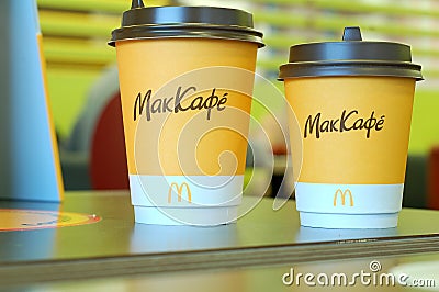 McDonald's Two glasses of coffee large and small Editorial Stock Photo
