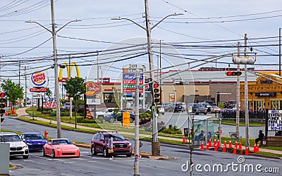 McDonalds, Burger King, Pizza Delight fast-food restaurants road side banners in a single frame. HALIFAX, NOVA SCOTIA, CANADA Editorial Stock Photo