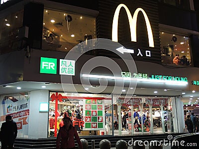 McDonalds shop, logo in China on top of shops with Christmas decorations Editorial Stock Photo