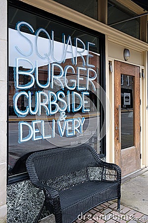 McKinney, Texas / USA - April 5, 2020: Curbside pick-up and delivery at Square Burger in downtown McKinney, Texas Editorial Stock Photo