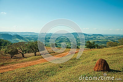 Meadows in a green valley with mound of tinder land Stock Photo